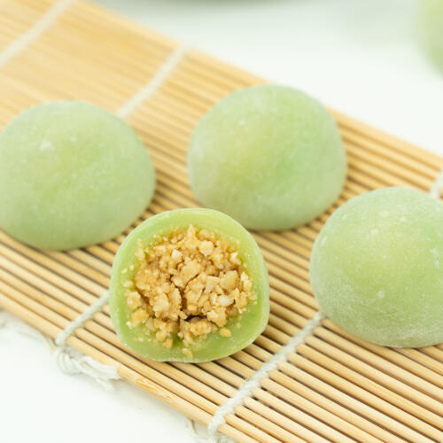 Chinese dessert mochi with ground peanut sugar filling